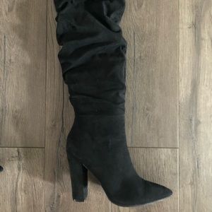 Black knee length boots by Guess